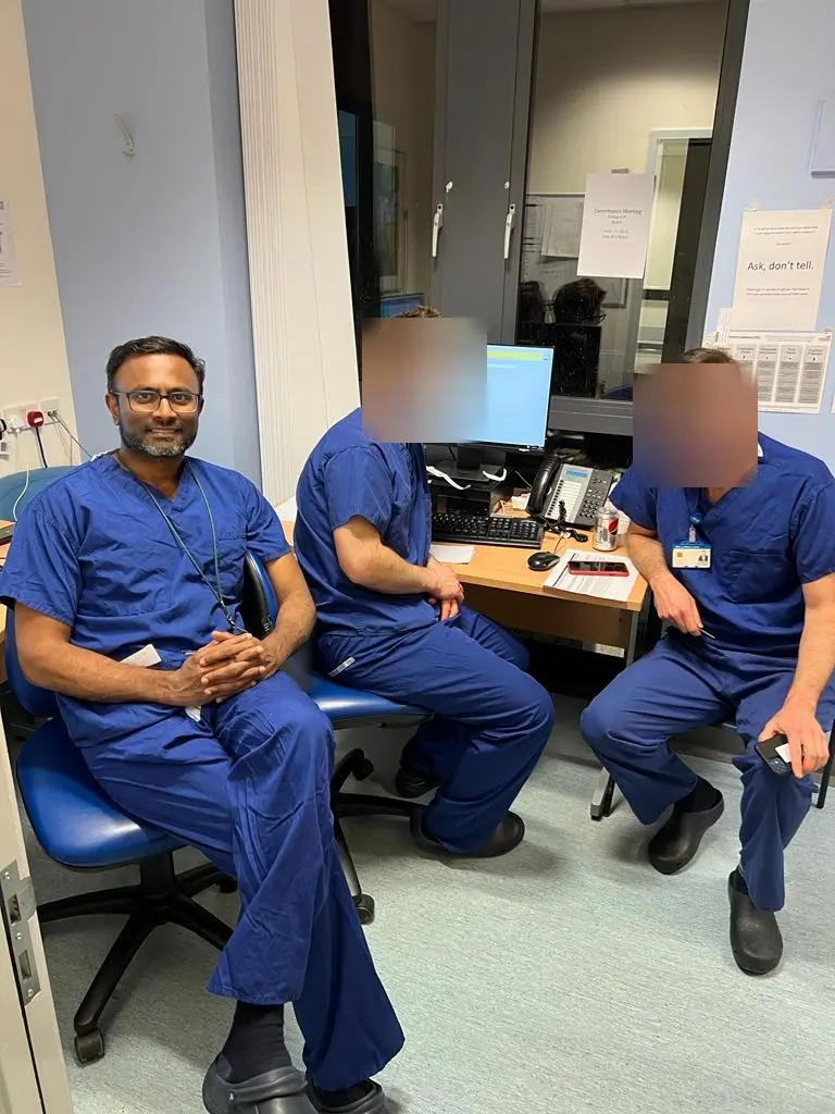 Professor Irshad Shaikh in scrubs
