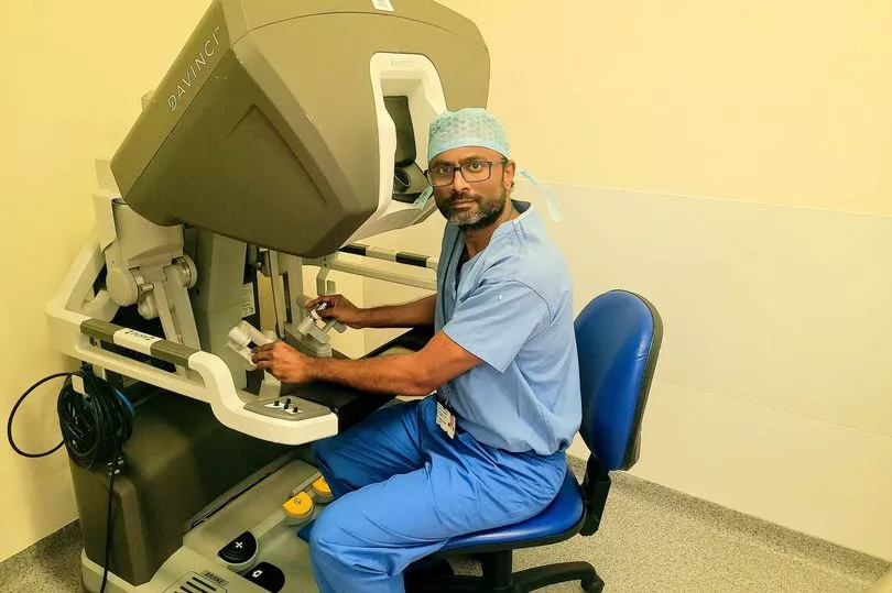 Professor Irshad Shaikh with a surgical robot